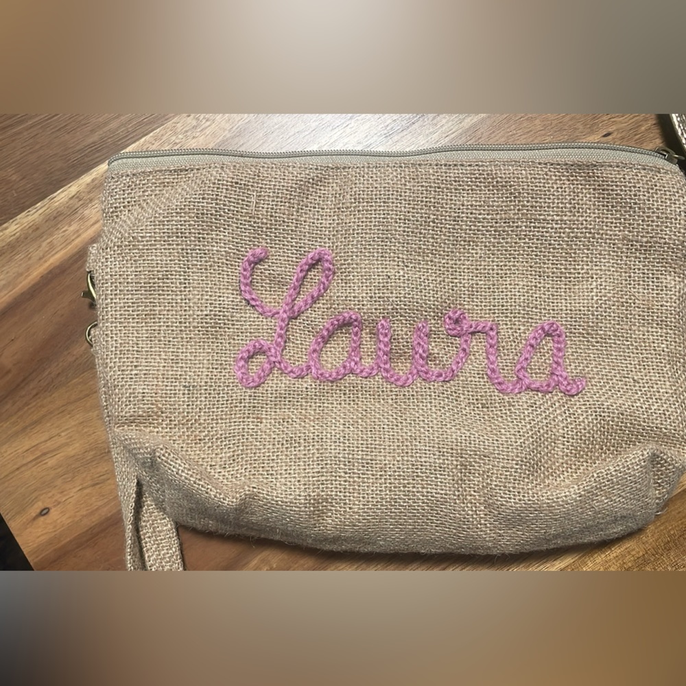 Clutch monogramed with the name Laura